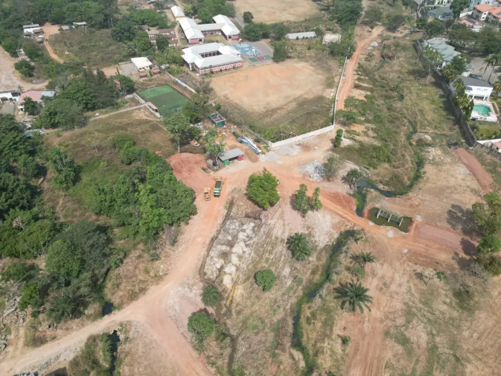 Aerial view of open land and a natural drainage line near Maitama, Abuja