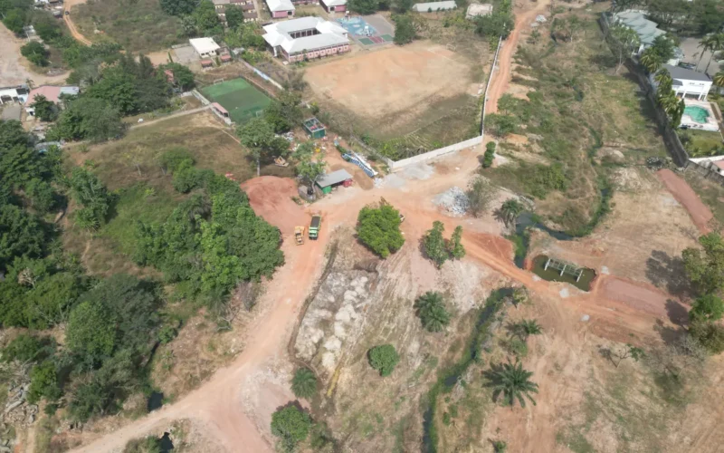 Aerial view of open land and a natural drainage line near Maitama, Abuja
