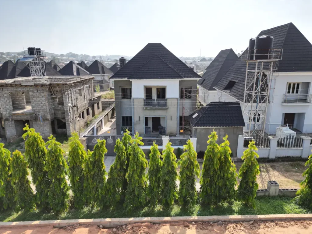 Modern homes with tiled roofs in an estate in Abuja