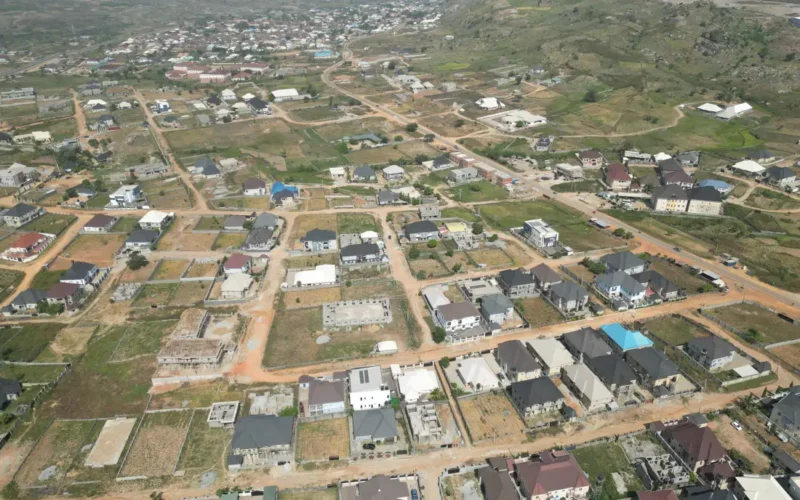 Aerial view of a housing estate with roads and homes in Abuja